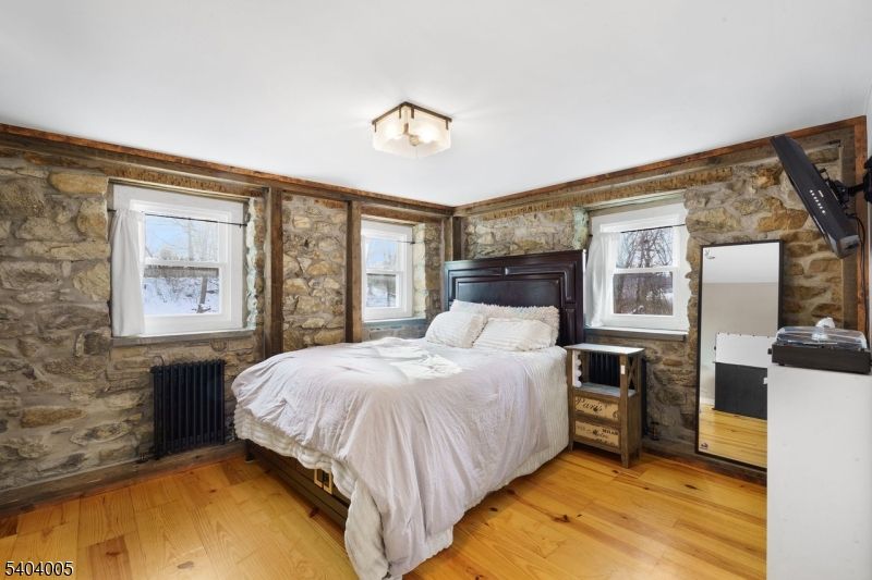 Bedroom, Fireplace, Interior, Stone Walls, Wood Texture Flooring