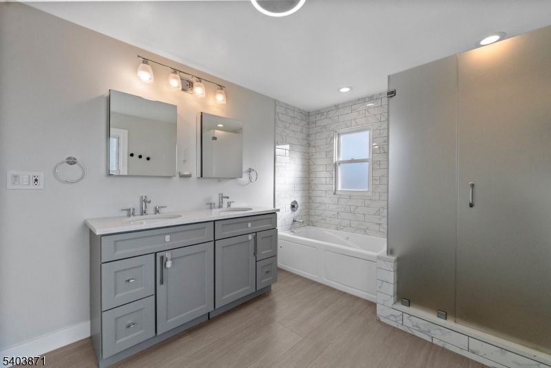 Bathroom, Dual Sink Vanities, Glass Shower, Interior, Recessed Lighting, Wood Texture Flooring