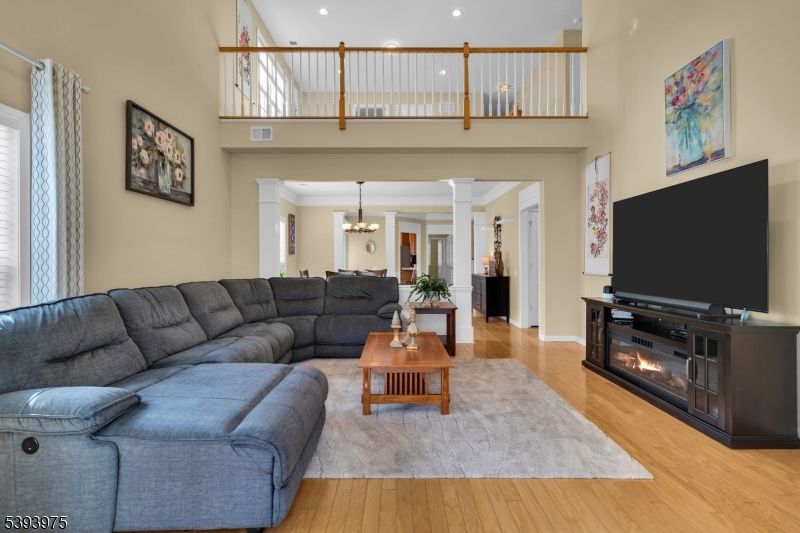 Chandelier, Fireplace, Interior, Living room, Recessed Lighting, Wood Texture Flooring