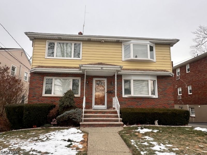 Exterior, Facade, Brick Facade, American Foursquare