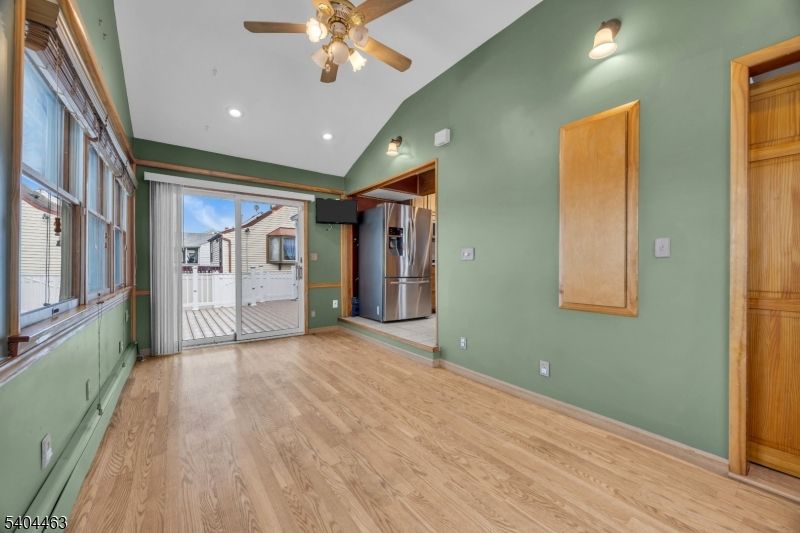 Empty room, Interior, Kitchen, Recessed Lighting, Stainless Steel Appliances, Wood Texture Flooring