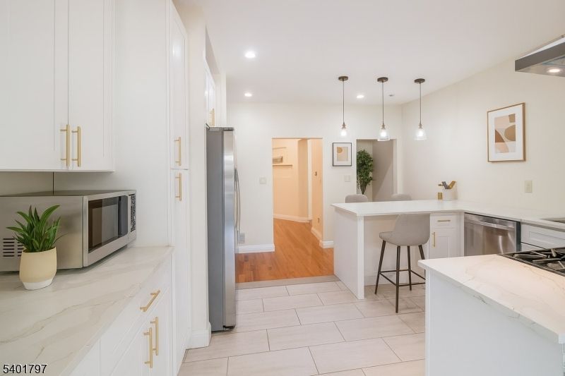 Interior, Kitchen, Pendant Lights, Recessed Lighting, Stainless Steel Appliances, Wood Texture Flooring