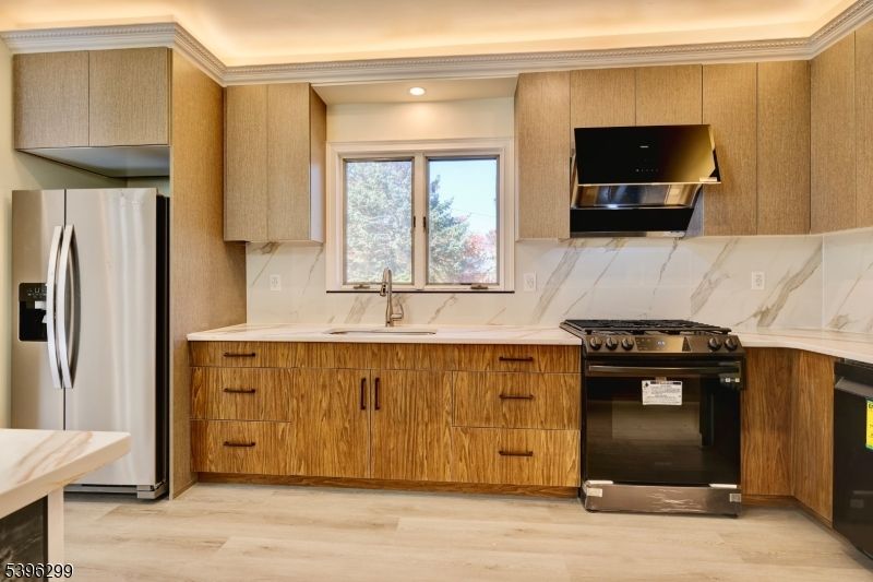 Interior, Kitchen, Marble Walls, Recessed Lighting, Stainless Steel Appliances, Wood Texture Flooring