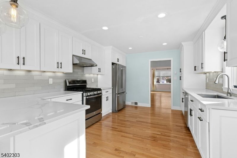 Interior, Kitchen, Pendant Lights, Recessed Lighting, Stainless Steel Appliances, Wood Texture Flooring