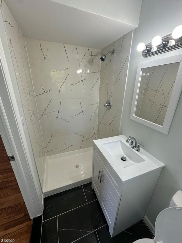 Bathroom, Dual Sink Vanities, Interior, Marble, Marble Walls, Wood Texture Flooring