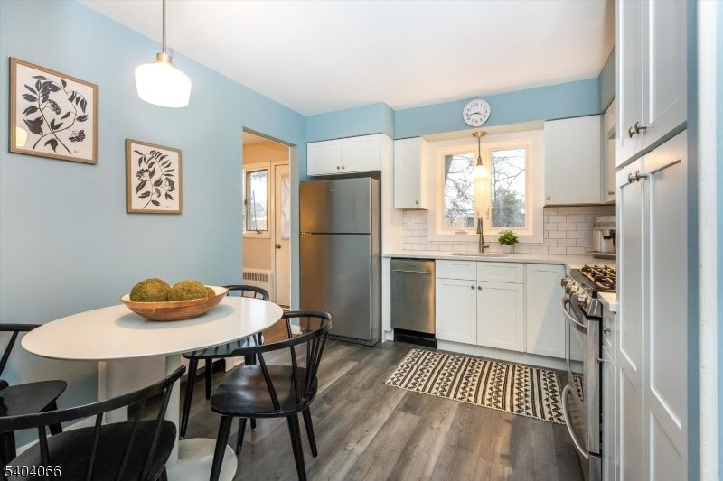 Dining room, Interior, Kitchen, Pendant Lights, Stainless Steel Appliances, Wood Texture Flooring
