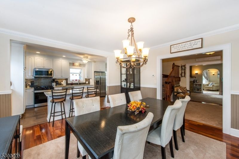 Chandelier, Dining room, Interior, Kitchen, Recessed Lighting, Stainless Steel Appliances, Wood Texture Flooring