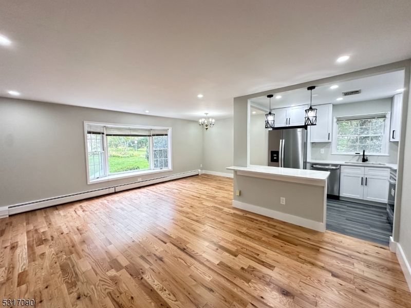 Chandelier, Interior, Kitchen, Pendant Lights, Recessed Lighting, Stainless Steel Appliances, Wood Texture Flooring