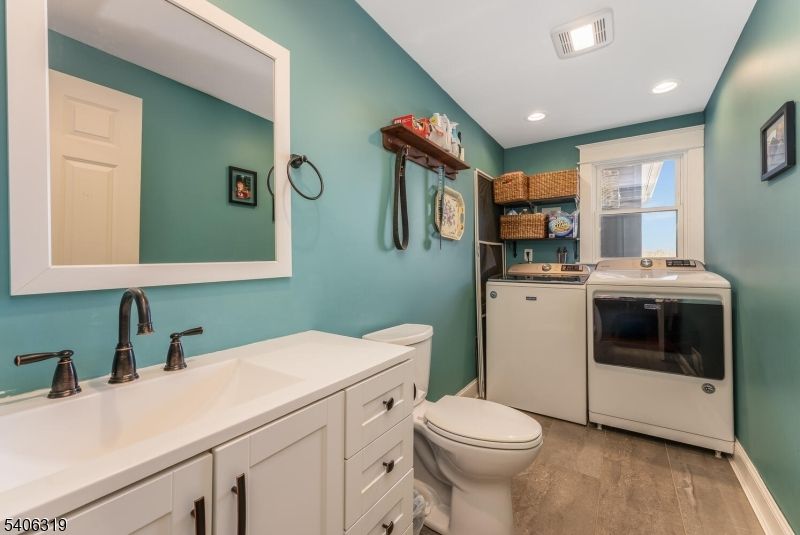 Bathroom, Interior, Recessed Lighting, Washer, Wood Texture Flooring