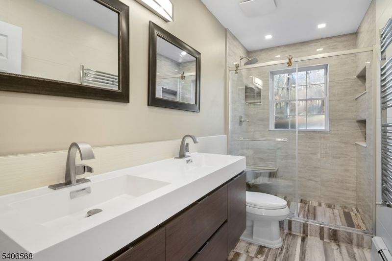 Bathroom, Dual Sink Vanities, Glass Shower, Interior, Recessed Lighting, Wood Texture Flooring