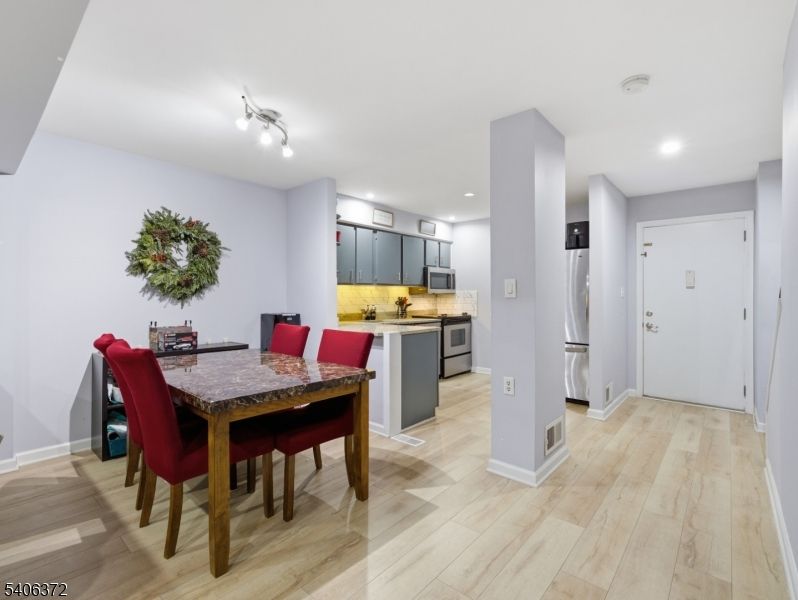 Dining room, Interior, Kitchen, Recessed Lighting, Stainless Steel Appliances, Wood Texture Flooring