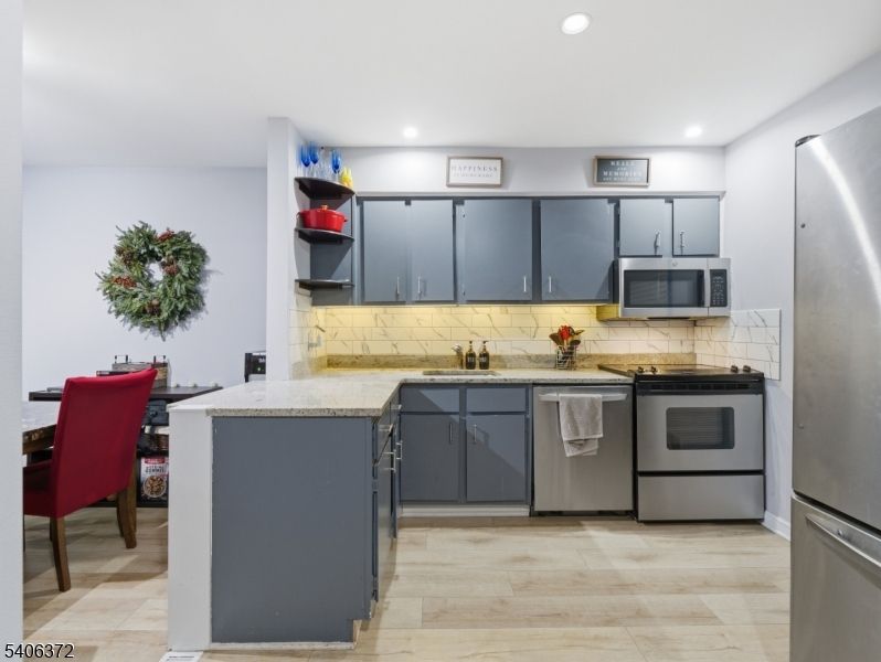 Dining room, Interior, Kitchen, Recessed Lighting, Stainless Steel Appliances, Wood Texture Flooring
