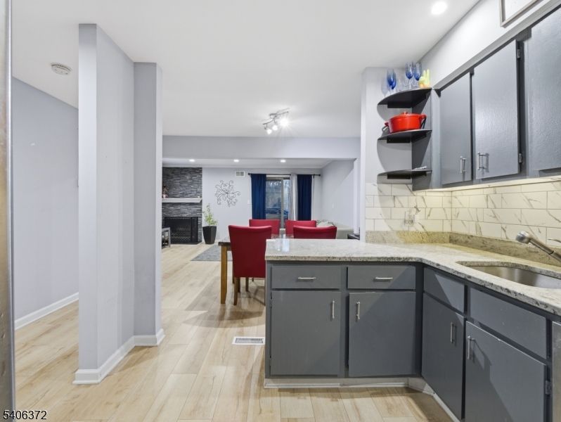 Dining room, Fireplace, Interior, Recessed Lighting, Wood Texture Flooring