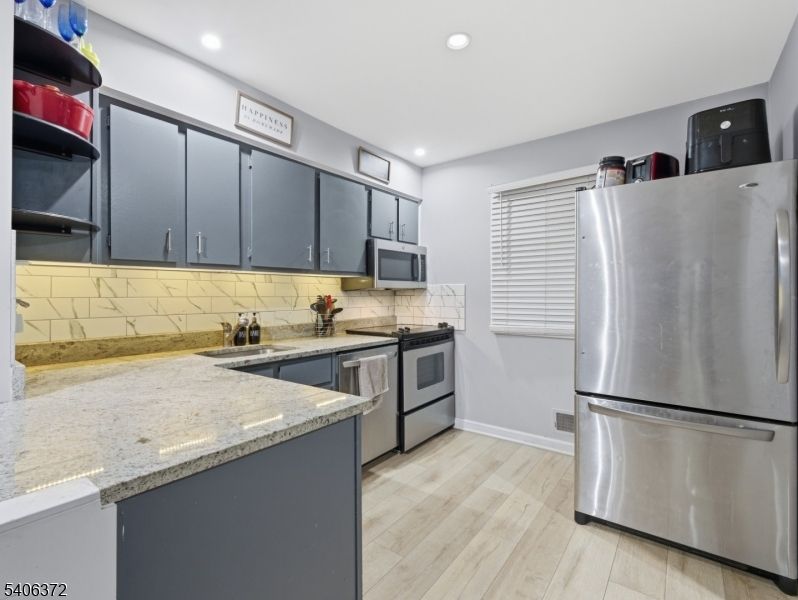 Interior, Kitchen, Recessed Lighting, Stainless Steel Appliances, Wood Texture Flooring