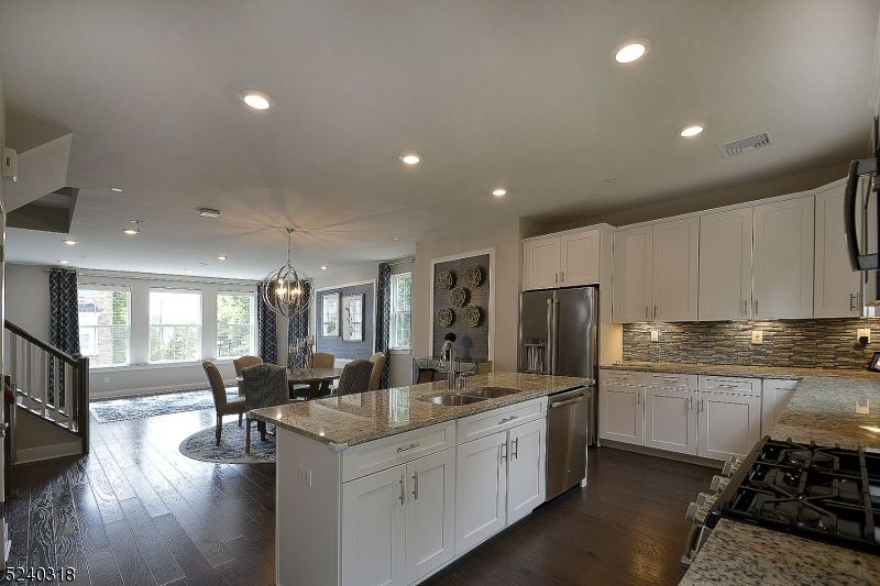 Chandelier, Dining room, Interior, Kitchen, Pendant Lights, Recessed Lighting, Stainless Steel Appliances, Wood Texture Flooring