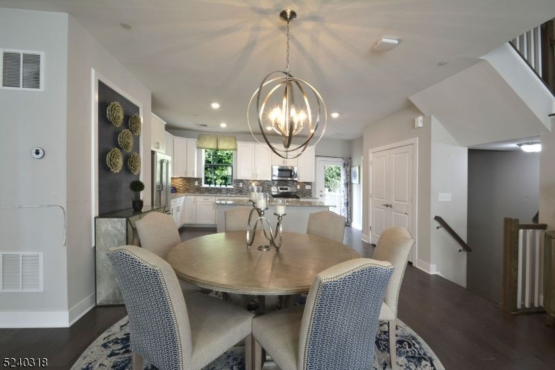 Chandelier, Dining room, Interior, Kitchen, Pendant Lights, Recessed Lighting, Stainless Steel Appliances, Wood Texture Flooring