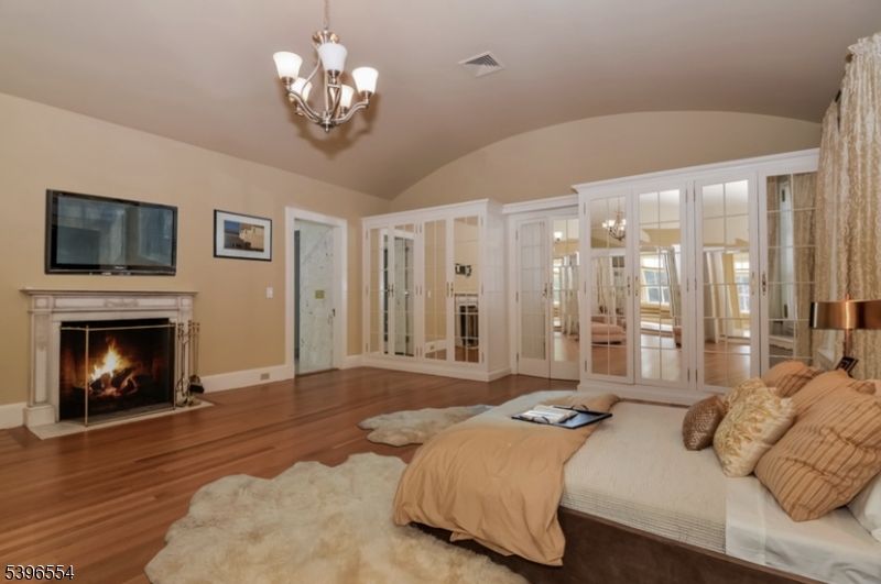 Bedroom, Chandelier, Fireplace, Interior, Wood Texture Flooring