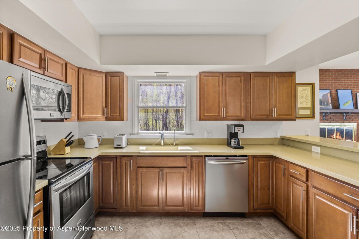 Fireplace, Interior, Kitchen, Stainless Steel Appliances, Stone Walls