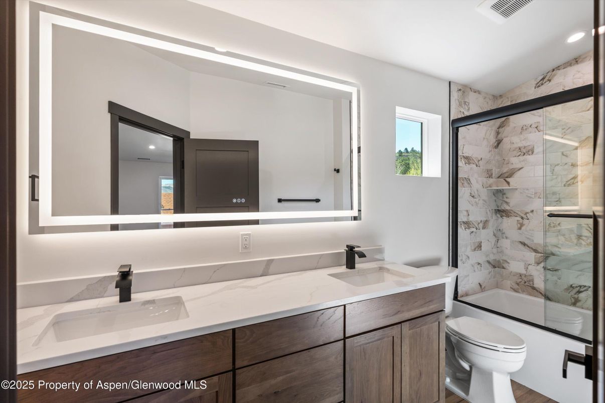 Bathroom, Dual Sink Vanities, Glass Shower, Interior, Marble Walls, Recessed Lighting
