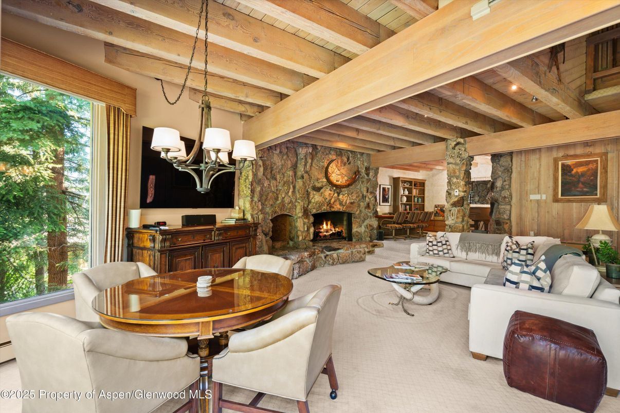 Chandelier, Dining room, Fireplace, Interior, Living room, Stone Walls, Wooden Beams, Wooden Ceilings
