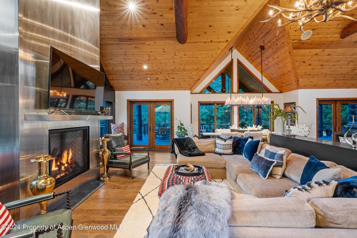Chandelier, Fireplace, Interior, Living room, Recessed Lighting, Wooden Beams, Wooden Ceilings, Wood Texture Flooring