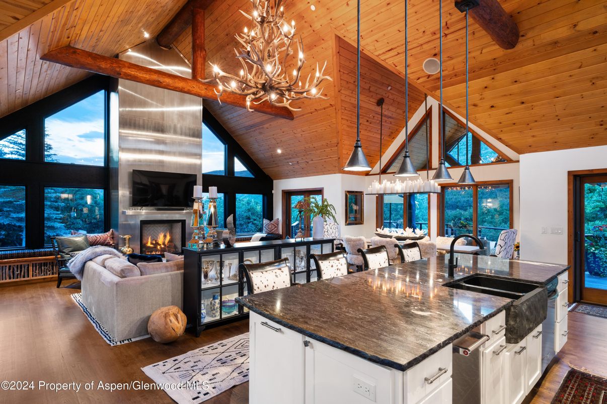 Chandelier, Dining room, Fireplace, Interior, Kitchen, Living room, Pendant Lights, Recessed Lighting, Wooden Beams, Wooden Ceilings, Wood Texture Flooring