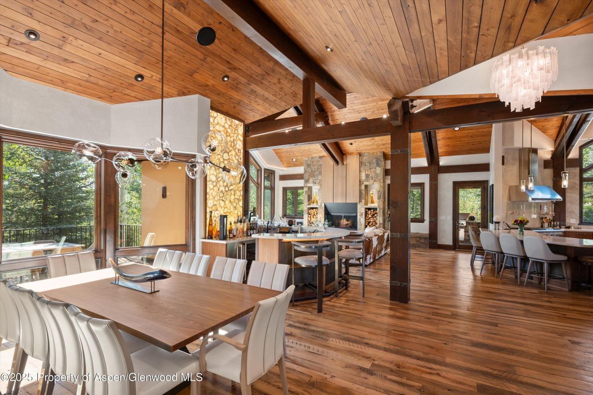Chandelier, Dining room, Fireplace, Interior, Pendant Lights, Recessed Lighting, Wooden Beams, Wooden Ceilings, Wood Texture Flooring