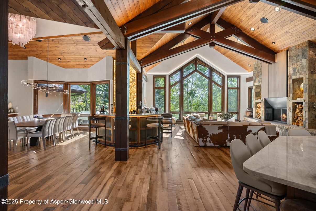 Chandelier, Dining room, Fireplace, Interior, Living room, Recessed Lighting, Wooden Beams, Wooden Ceilings, Wood Texture Flooring