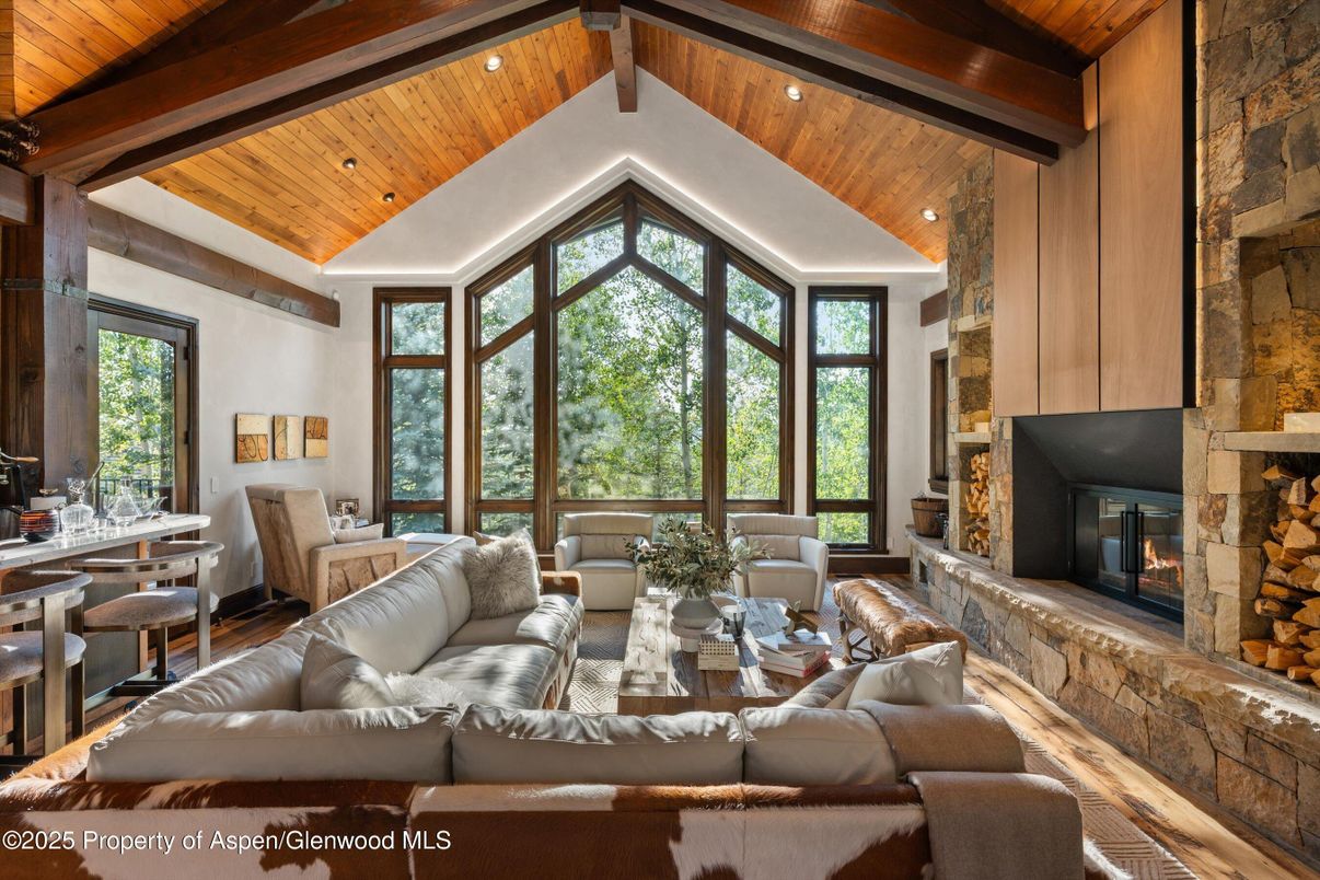 Dining room, Fireplace, Interior, Living room, Recessed Lighting, Stone Walls, Wooden Beams, Wooden Ceilings, Wood Texture Flooring