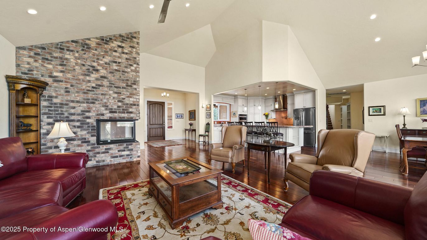 Dining room, Fireplace, Interior, Kitchen, Living room, Pendant Lights, Recessed Lighting, Stainless Steel Appliances, Stone Walls, Wood Texture Flooring