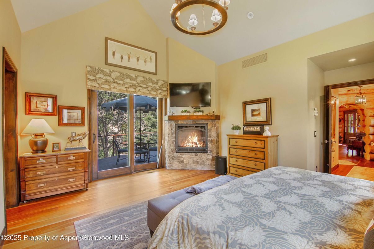Bedroom, Fireplace, Interior, Pendant Lights, Recessed Lighting, Wood Texture Flooring