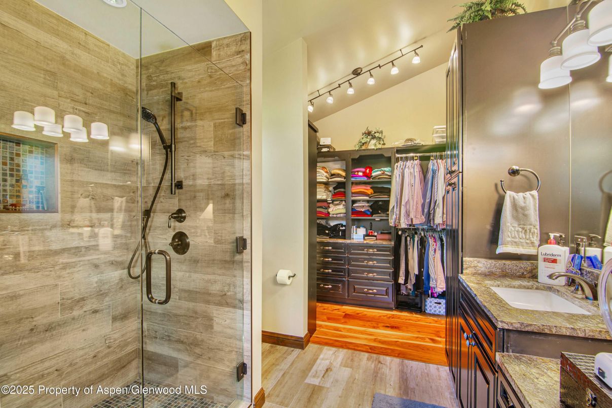 Bathroom, Dual Sink Vanities, Glass Shower, Interior, Walk-in Closets, Wood Texture Flooring