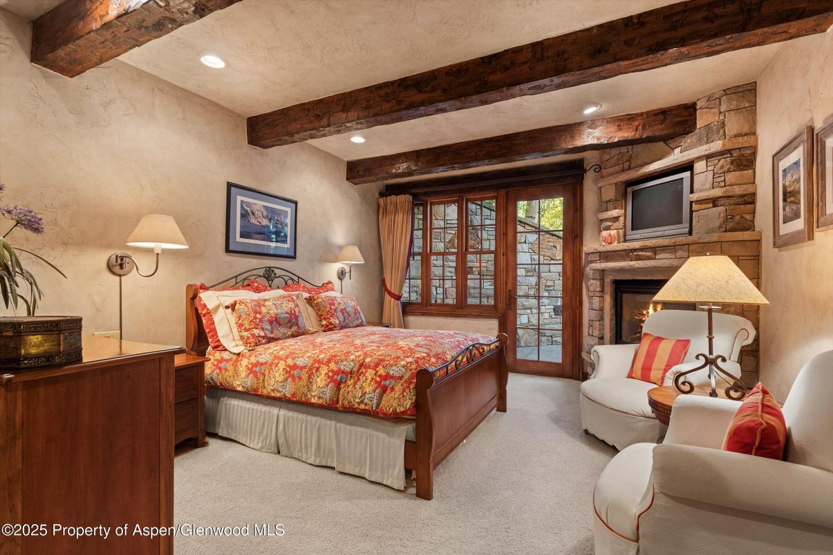 Bedroom, Fireplace, Interior, Recessed Lighting, Stone Walls, Wooden Beams