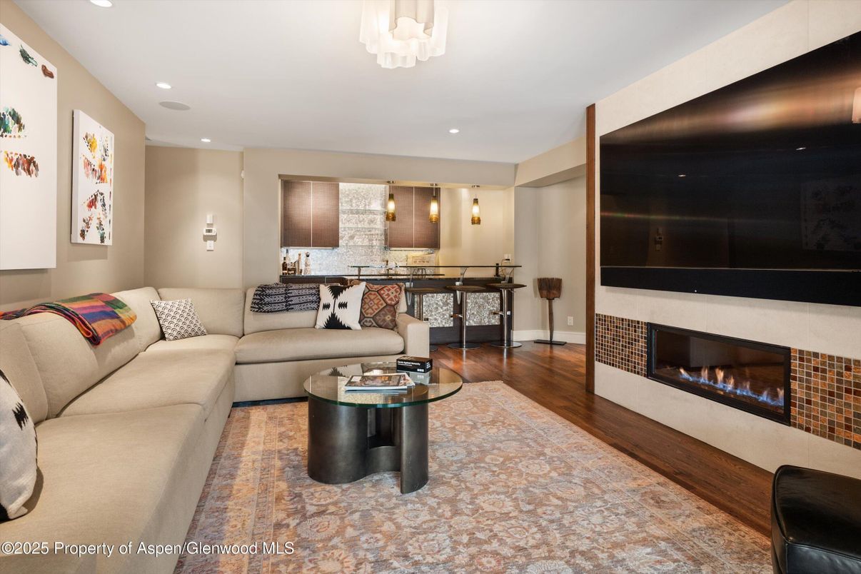 Fireplace, Interior, Living room, Pendant Lights, Recessed Lighting, Stone Walls, Wood Texture Flooring