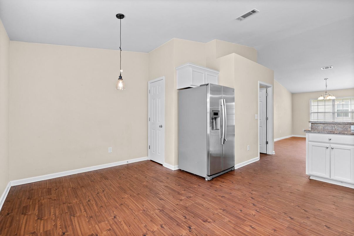 Empty room, Interior, Kitchen, Pendant Lights, Stainless Steel Appliances, Wood Texture Flooring