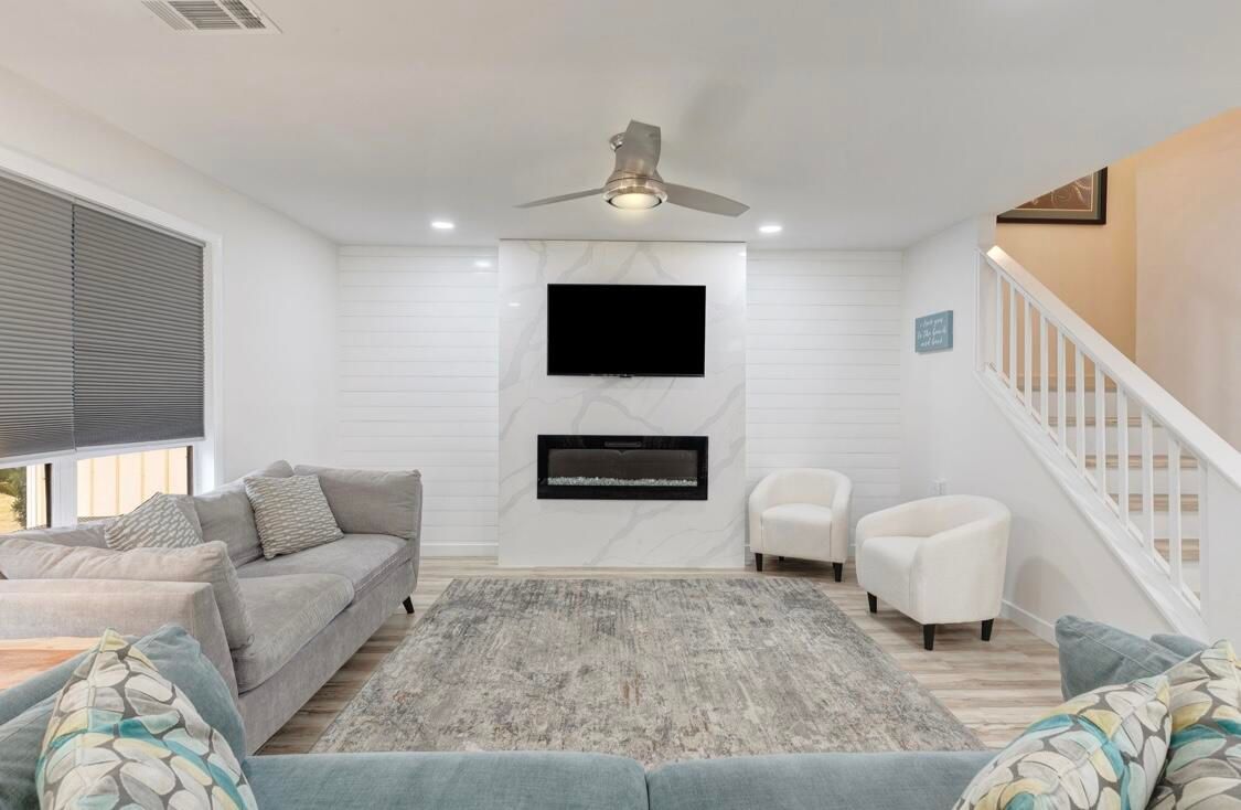 Fireplace, Interior, Living room, Marble Walls, Recessed Lighting, Wood Texture Flooring