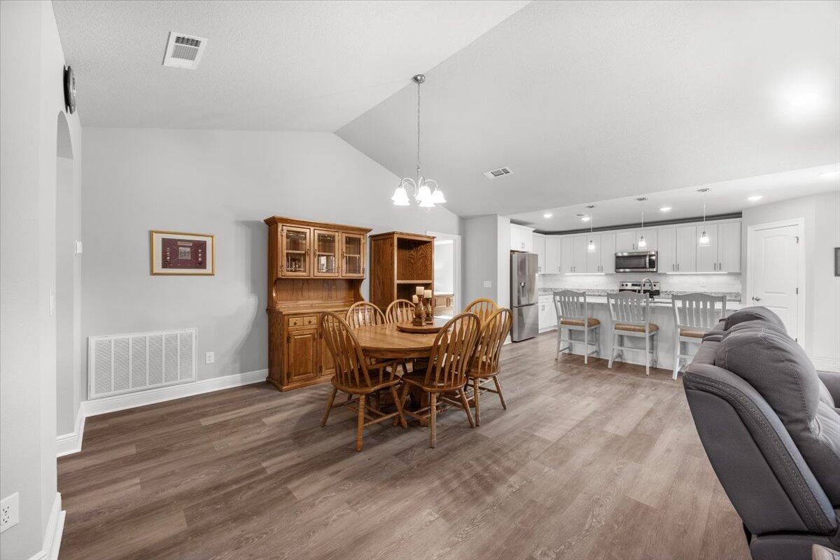 Dining room, Interior, Kitchen, Pendant Lights, Recessed Lighting, Stainless Steel Appliances, Wood Texture Flooring