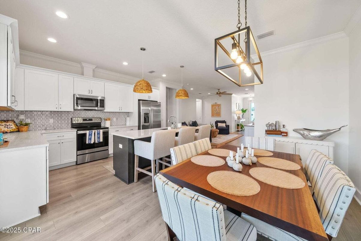 Dining room, Interior, Kitchen, Pendant Lights, Recessed Lighting, Stainless Steel Appliances, Wood Texture Flooring