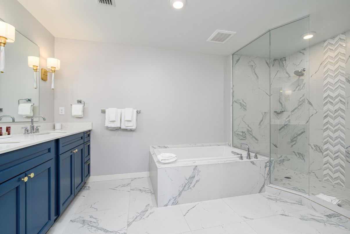Bathroom, Dual Sink Vanities, Glass Shower, Interior, Marble, Marble Walls, Recessed Lighting