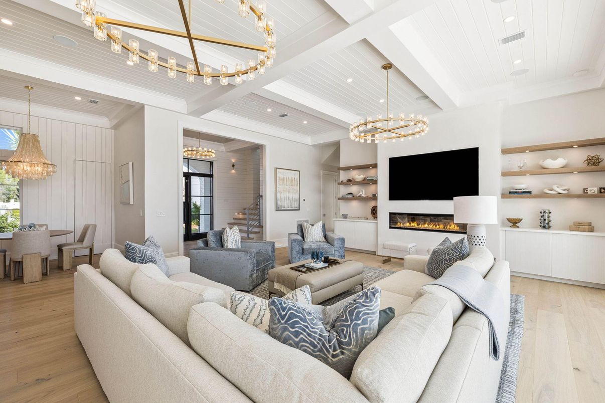 Chandelier, Dining room, Fireplace, Interior, Living room, Pendant Lights, Recessed Lighting, Wood Texture Flooring