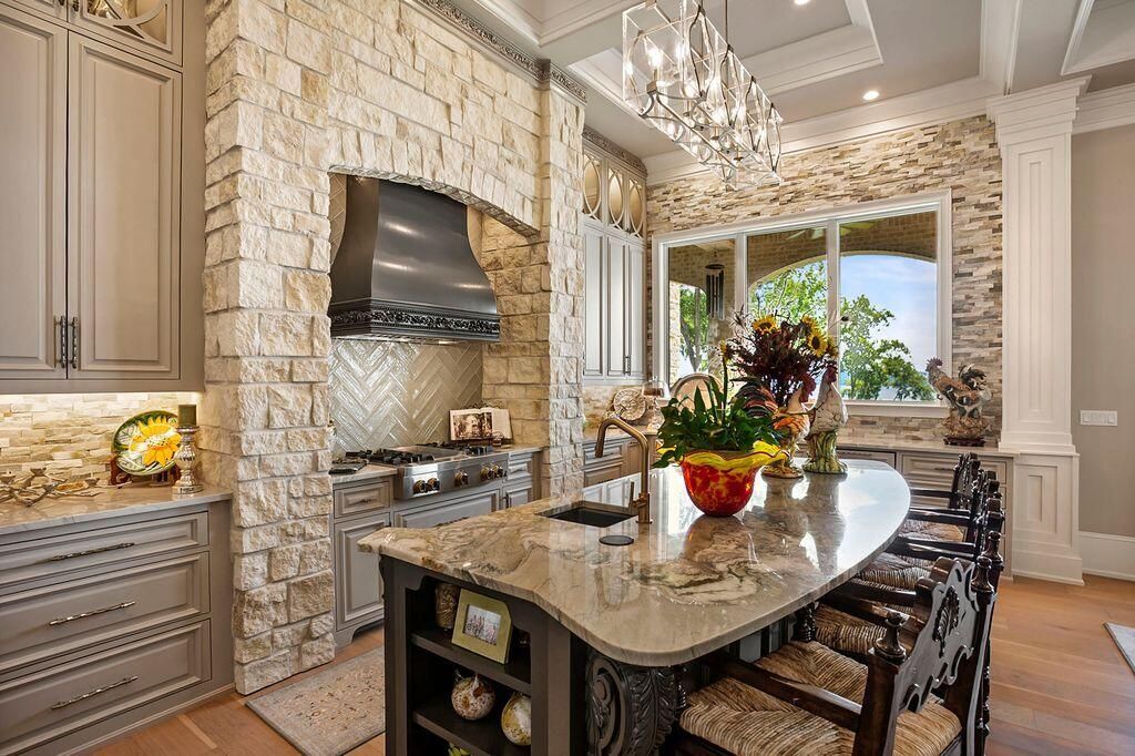 Chandelier, Interior, Kitchen, Pendant Lights, Recessed Lighting, Stainless Steel Appliances, Stone Walls, Wood Texture Flooring