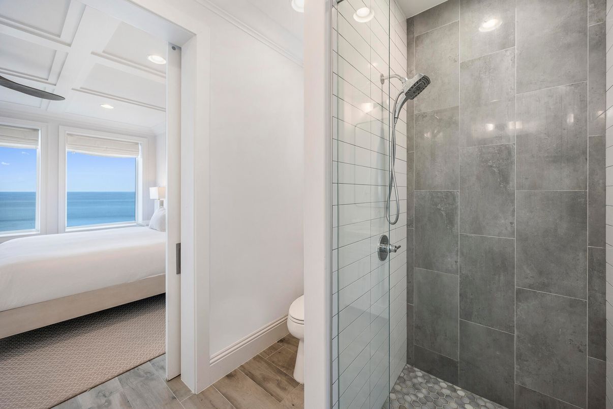 Bathroom, Bedroom, Glass Shower, Interior, Recessed Lighting, Water, Wood Texture Flooring