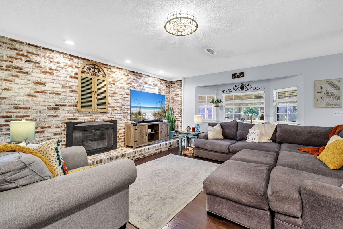 Fireplace, Interior, Living room, Recessed Lighting, Stone Walls, Wood Texture Flooring