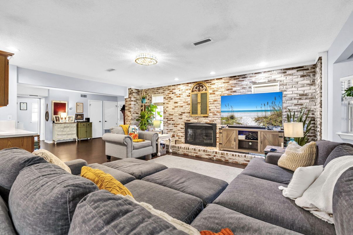 Fireplace, Interior, Living room, Recessed Lighting, Stone Walls, Wood Texture Flooring