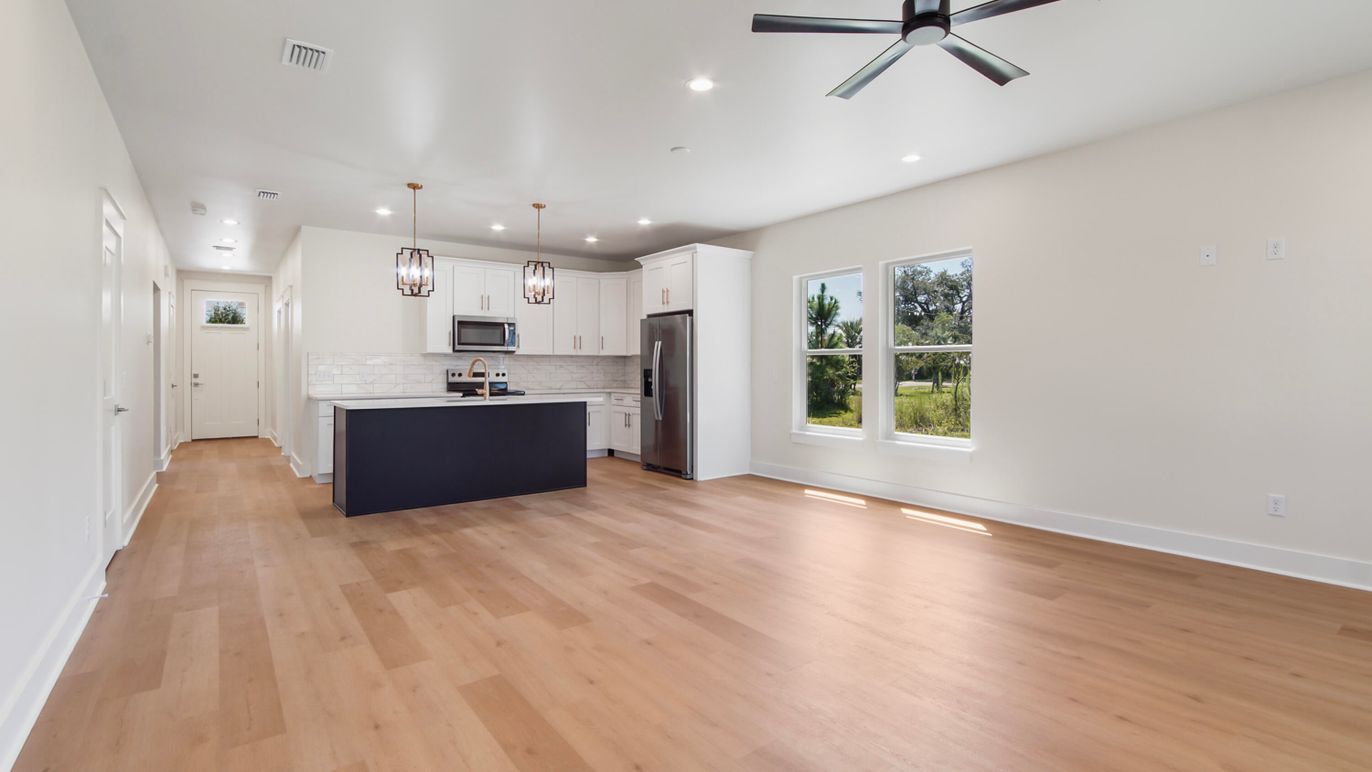 Empty room, Interior, Kitchen, Pendant Lights, Recessed Lighting, Stainless Steel Appliances, Wood Texture Flooring