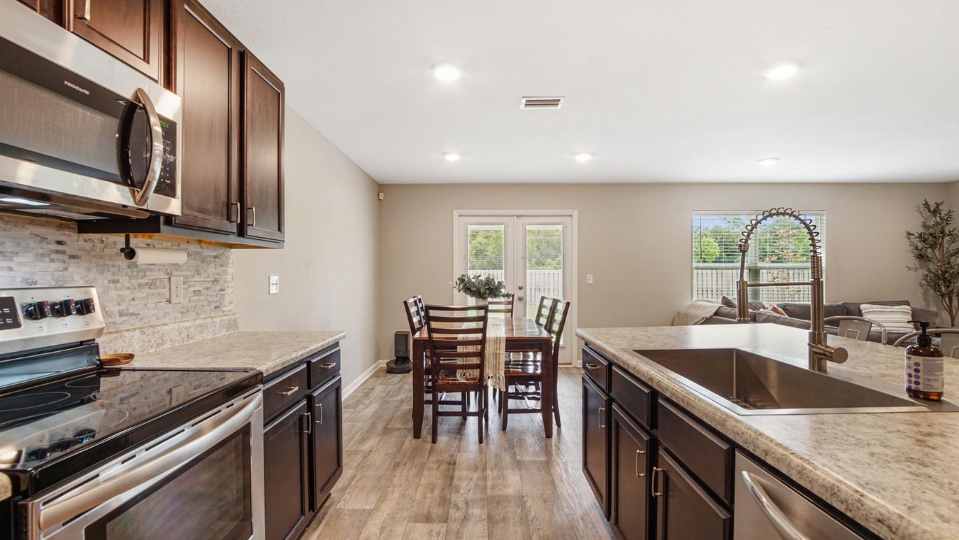 Dining room, Interior, Kitchen, Recessed Lighting, Stainless Steel Appliances, Wood Texture Flooring