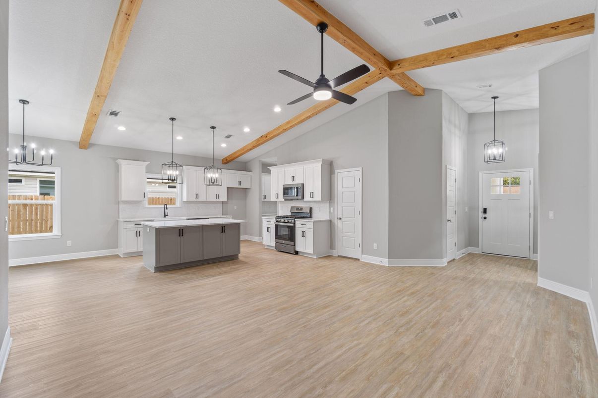 Empty room, Interior, Kitchen, Pendant Lights, Recessed Lighting, Stainless Steel Appliances, Wooden Beams, Wood Texture Flooring