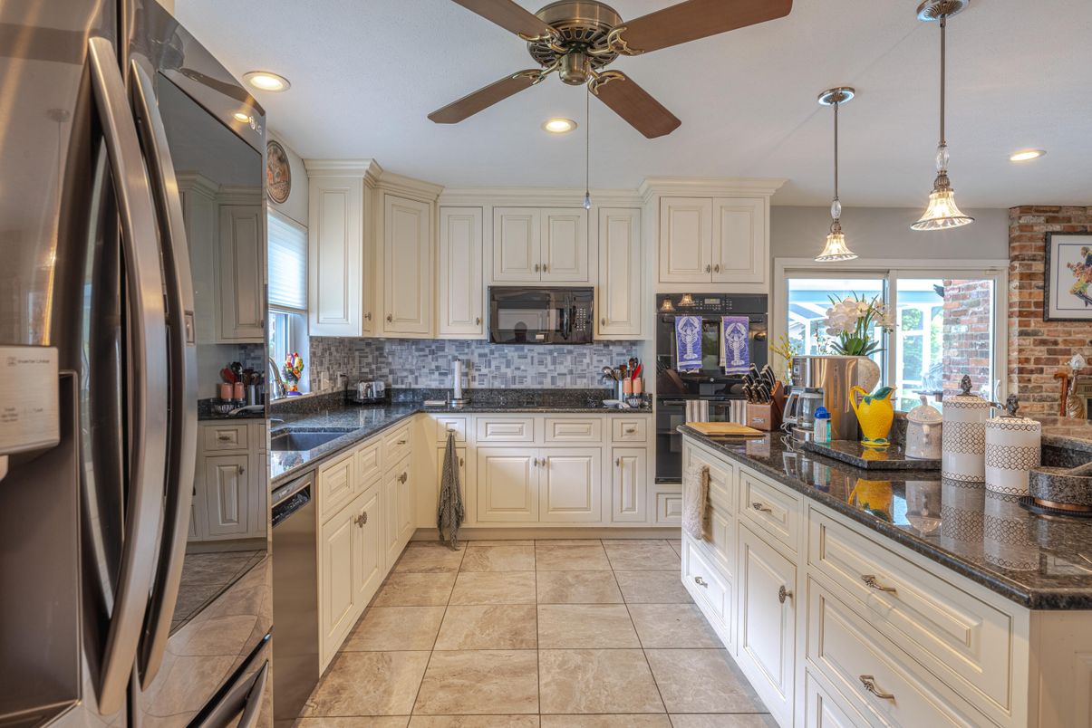 Interior, Kitchen, Pendant Lights, Recessed Lighting, Stainless Steel Appliances, Stone Walls