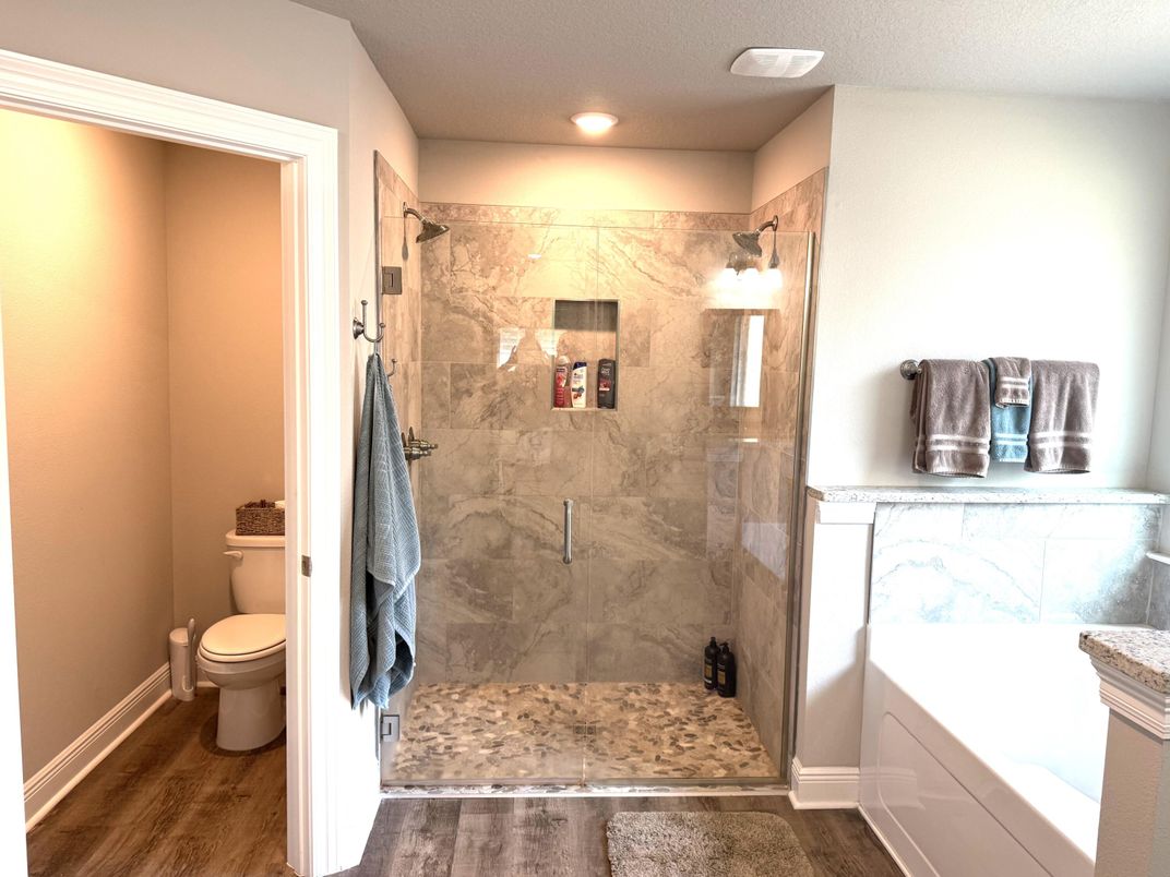 Bathroom, Glass Shower, Interior, Marble Walls, Recessed Lighting, Wood Texture Flooring