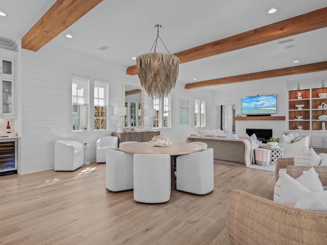 Chandelier, Dining room, Fireplace, Interior, Living room, Recessed Lighting, Stone Walls, Wooden Beams, Wood Texture Flooring